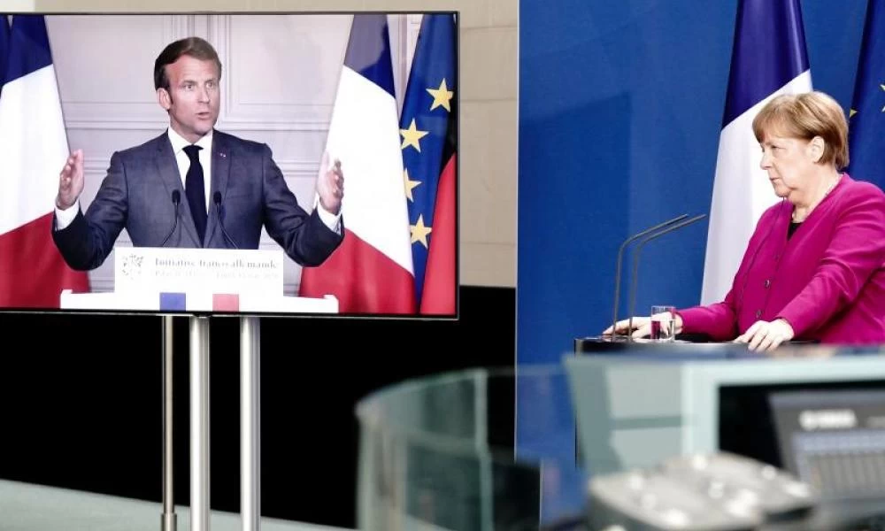 Bloomberg: "Βιασύνες" από Μέρκελ και Μακρόν για το Ταμείο Ανάκαμψης